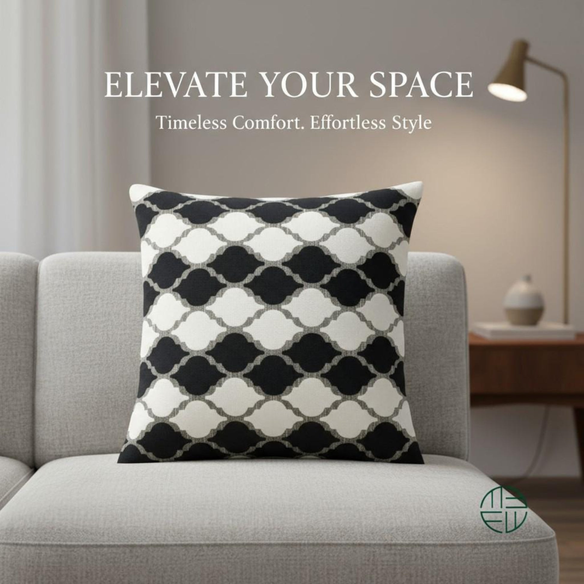 Decorative pillow with black and white pattern on a gray sofa, with text 'Elevate Your Space' above.