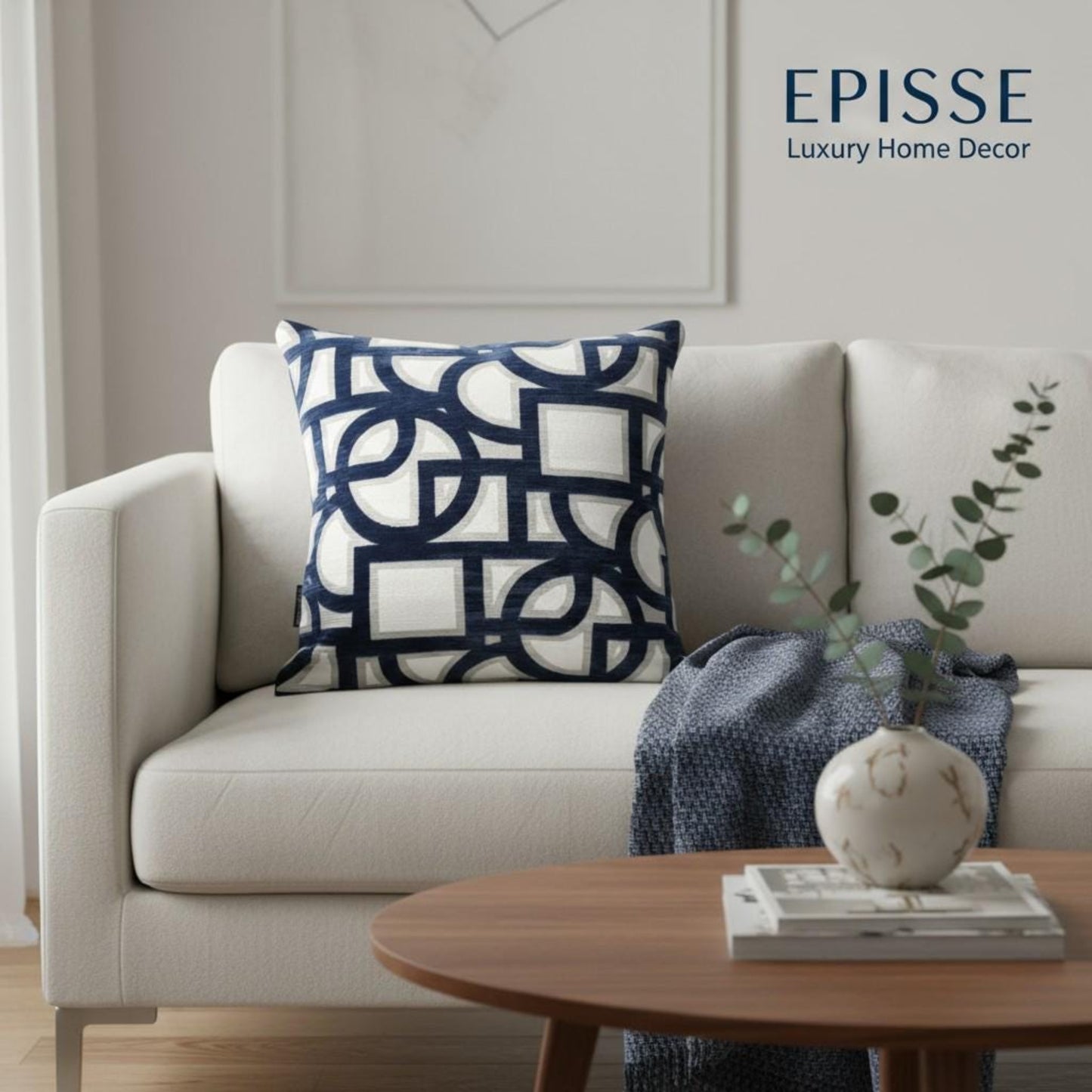 Beige sofa with a decorative pillow and a plant on a wooden table, featuring the Episse logo.