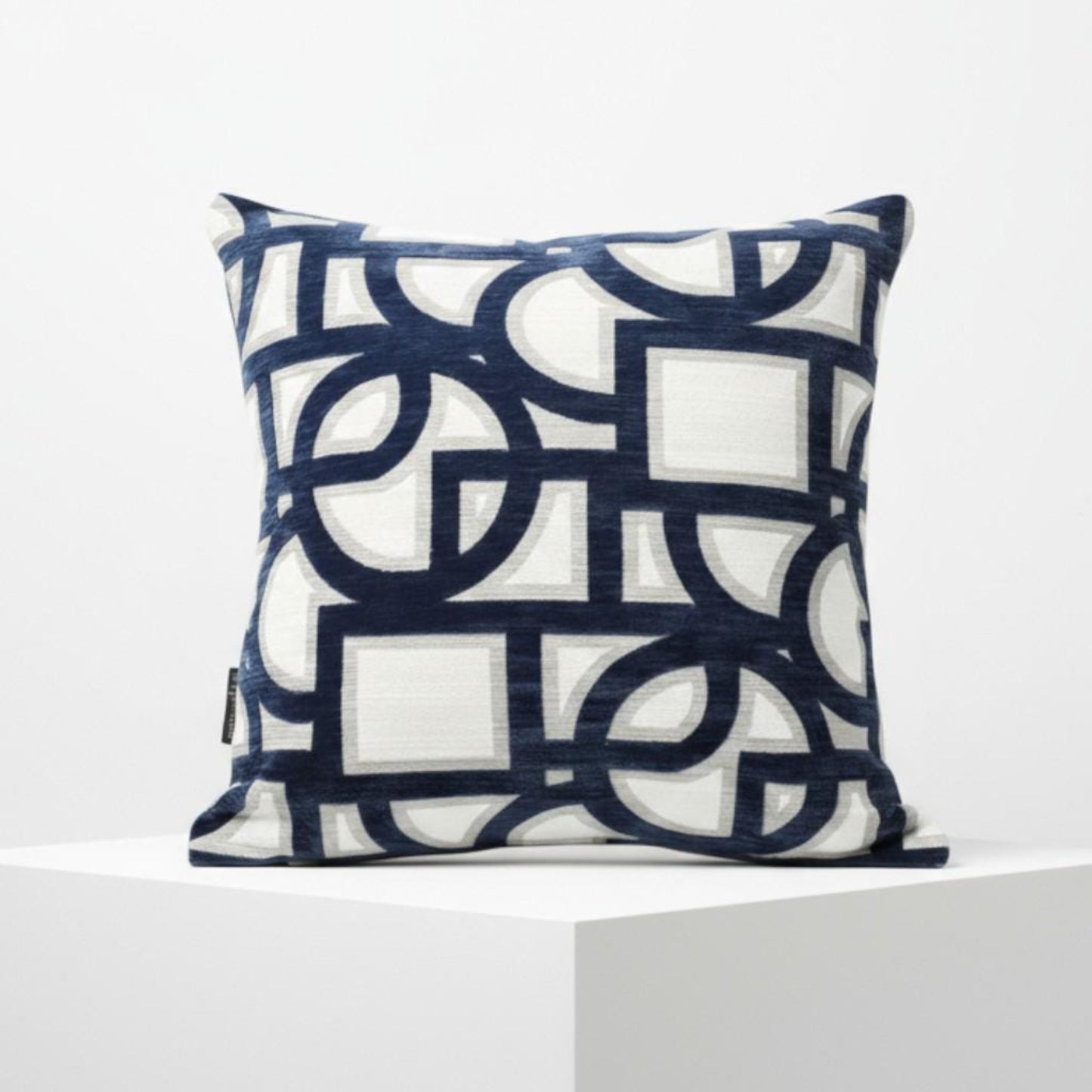 Decorative pillow with geometric pattern on a white background