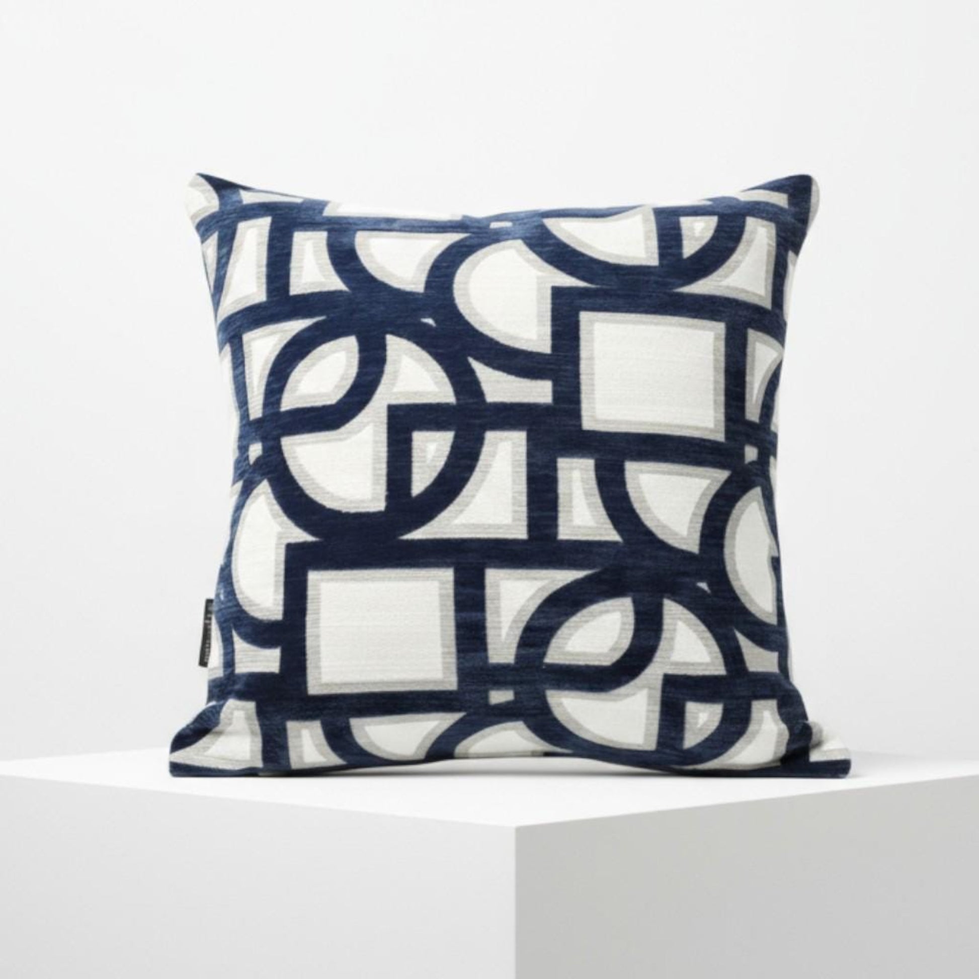 Decorative pillow with geometric pattern on a white background