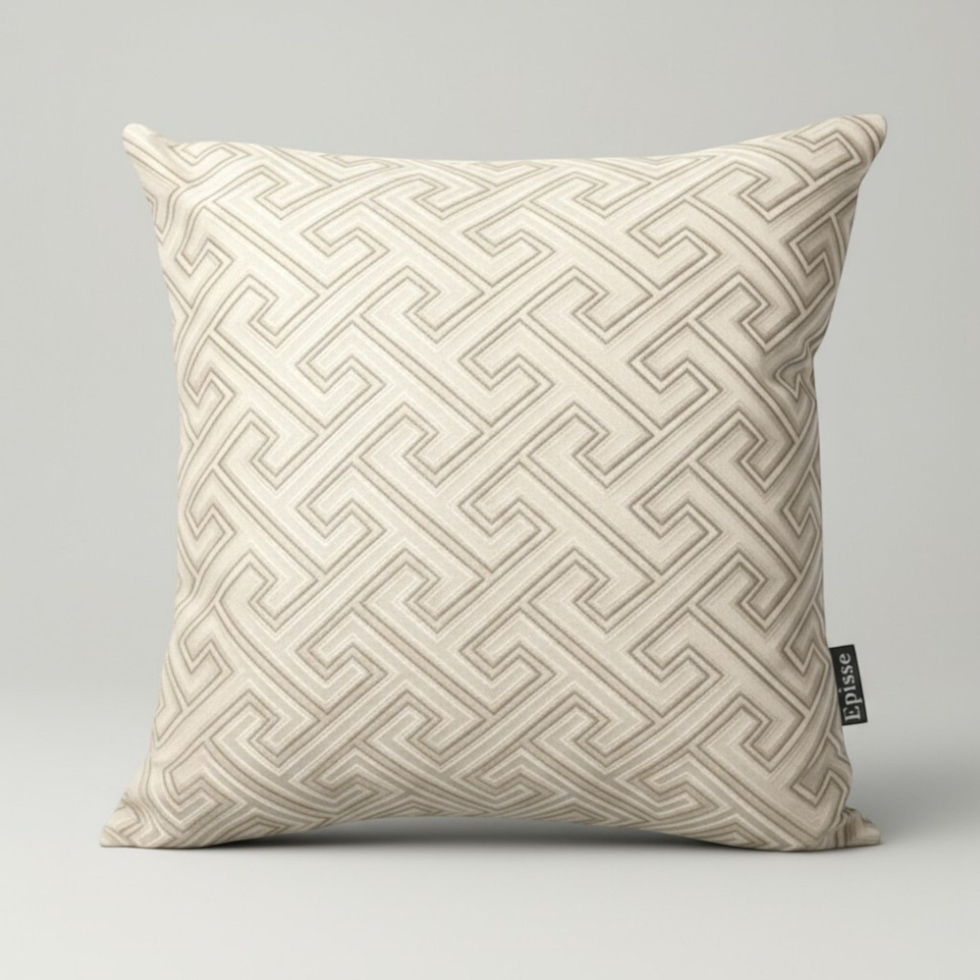 Beige pillow with geometric pattern on a gray background
